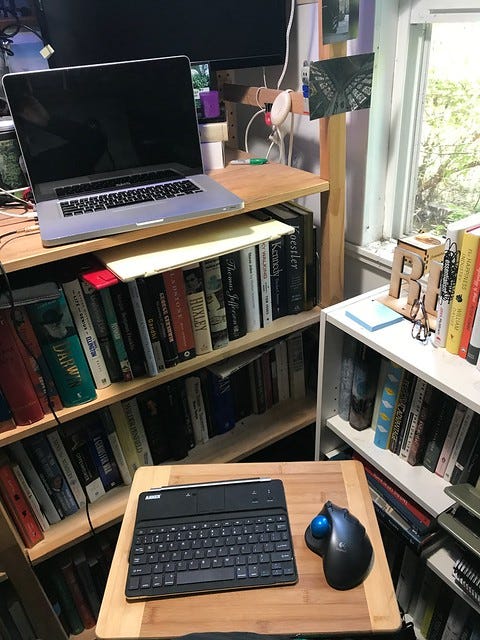 New lap desk: a bamboo cutting board from the kitchen. New lap desk: a bamboo cutting board from the kitchen.