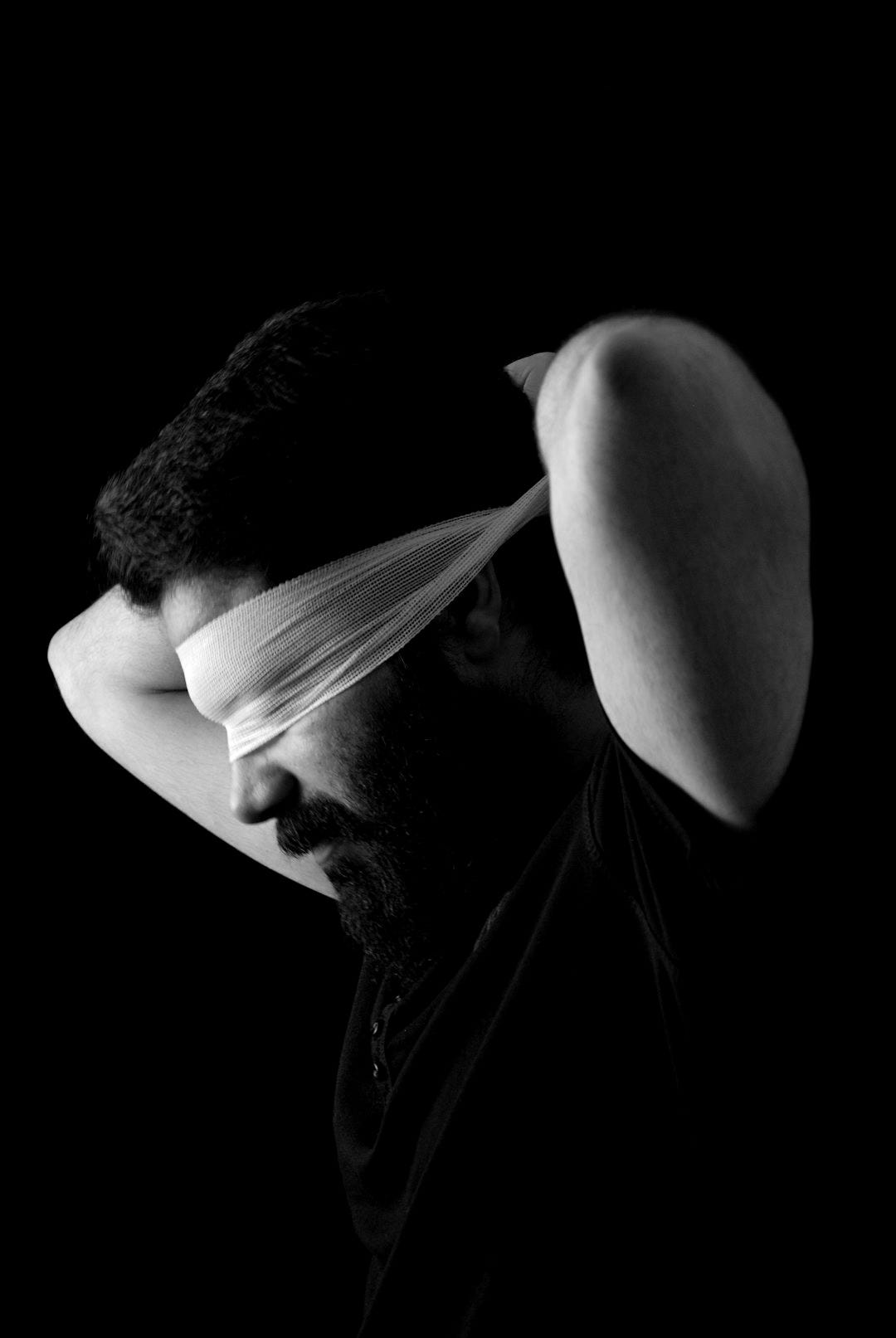 a man with a bandage around his head