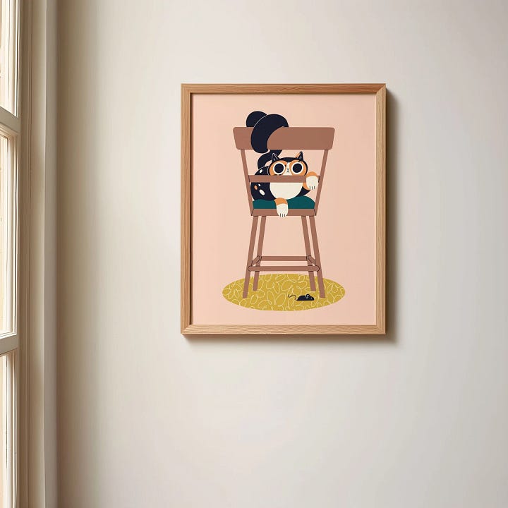 First photo: a framed print of a cat on a chair.  Second photo: an anchovy hairclip