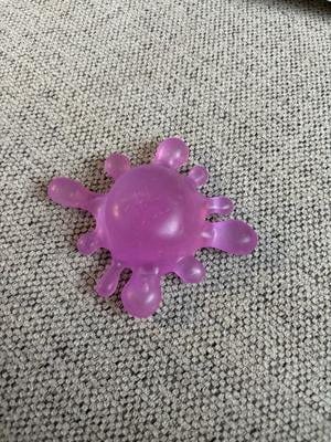 A NeeDoh SplootSplat in purple. It looks like a...splatter....of something