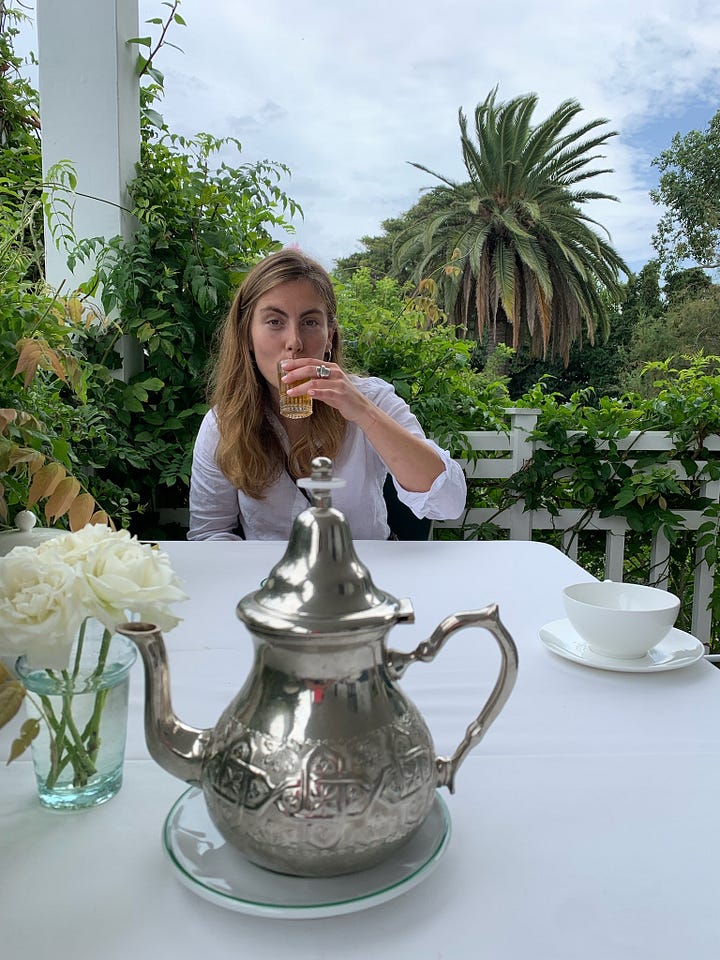 A picture of some round moroccan flat breads, a picture of me drinking mint tea and the choux bun filled with whipped cream and chocolate pouring over the top
