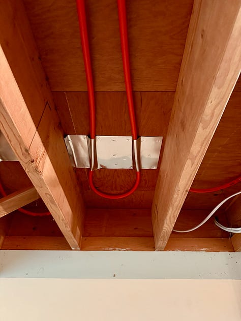 Two images showing a kink in a PEX tube and a splice to fix the kink.