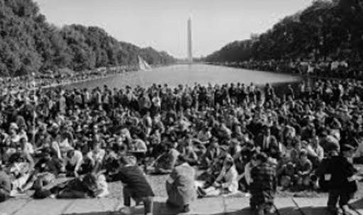 A group of people sitting on the ground

AI-generated content may be incorrect.