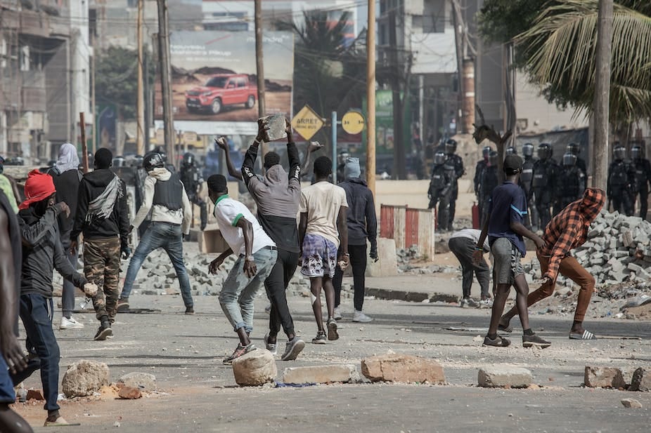 People throwing stones at the police 