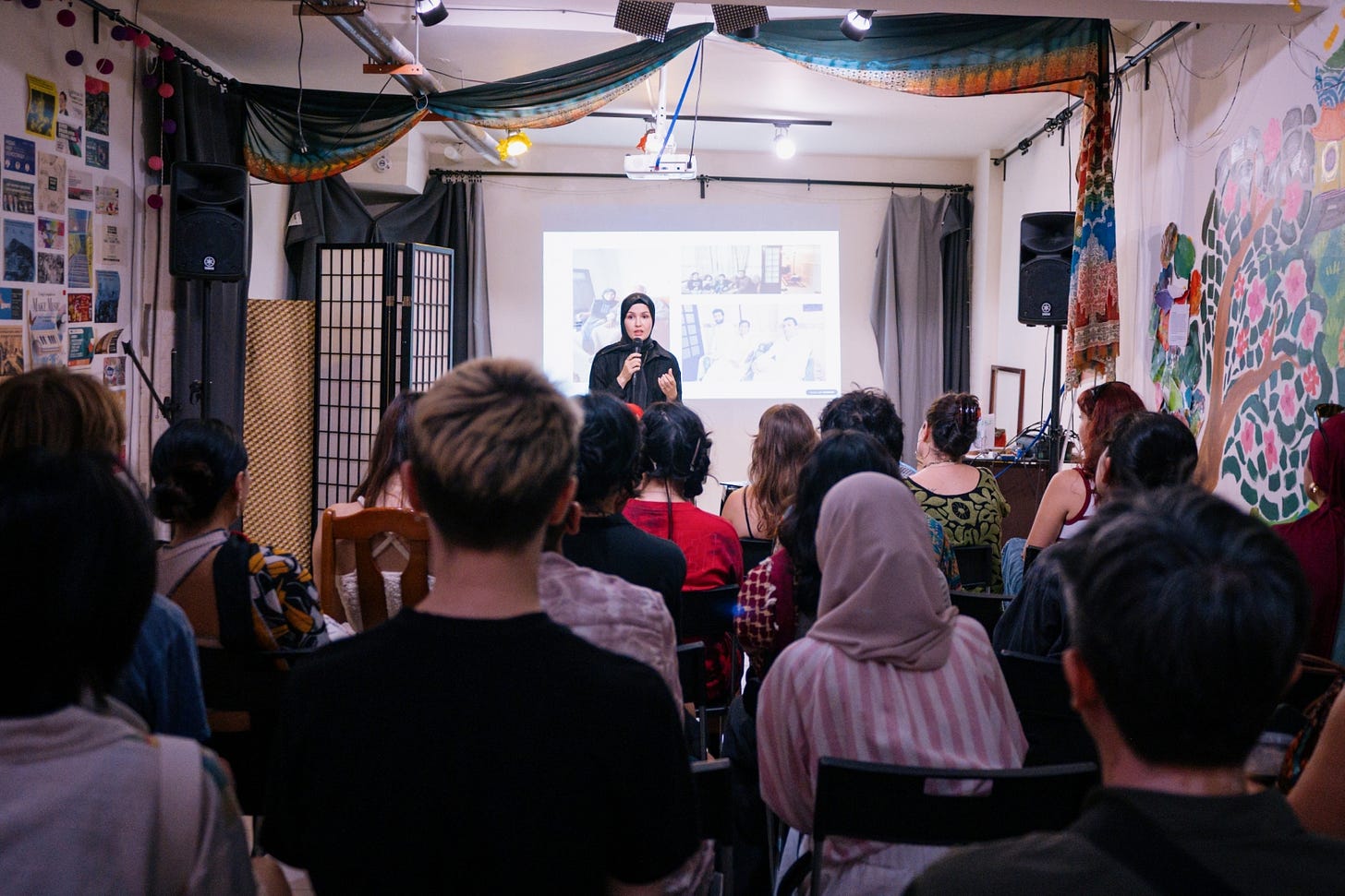Photo of Dr. Amel Eid speaks on grief, resilience, and the concept of Sumud at a fundraiser for Palestinians at Daybreak. 