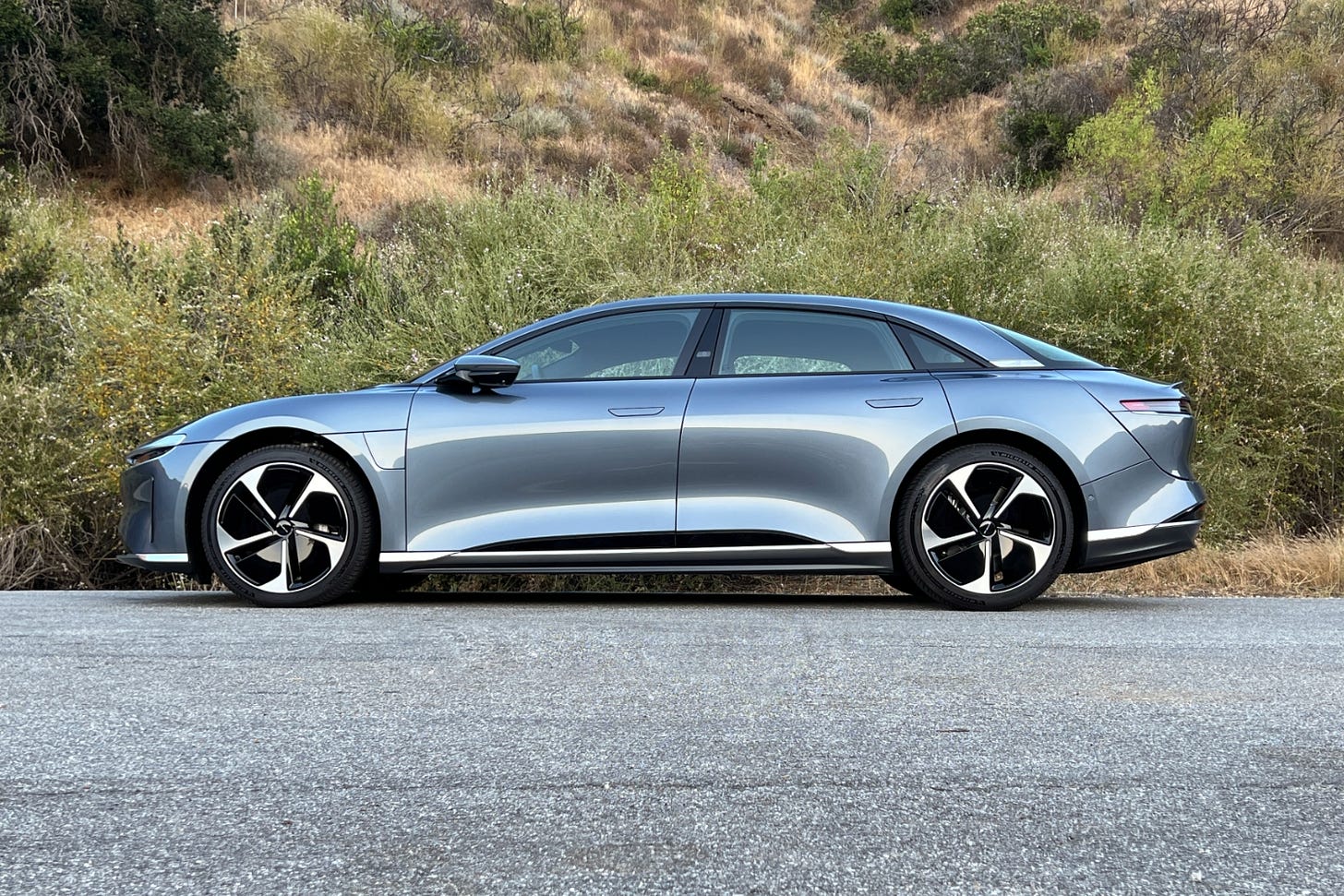 2023 Lucid Air Pure in Quantum Gray, viewed from the side.