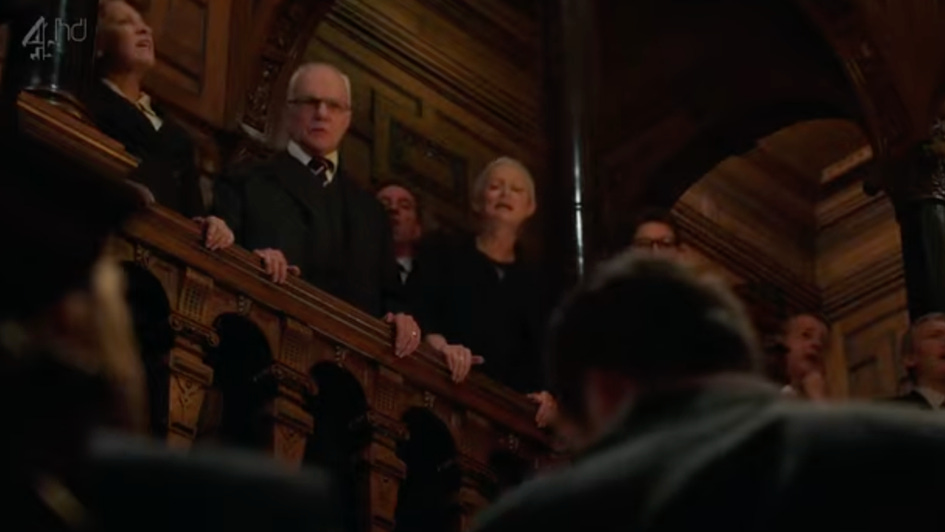 A group of people standing on a railing

AI-generated content may be incorrect.