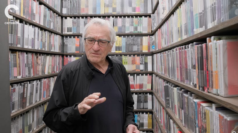 Robert De Niro stands in front of the Criterion Closet