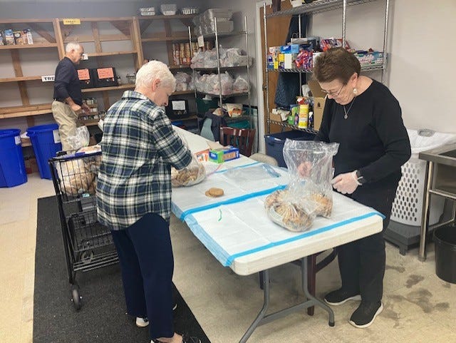 picture of FISH volunteers and food pantry