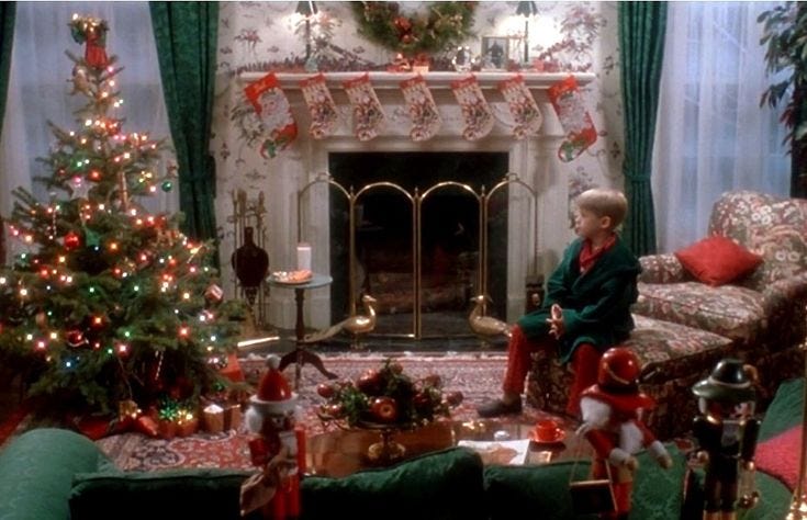 This may contain: a living room decorated for christmas with green furniture