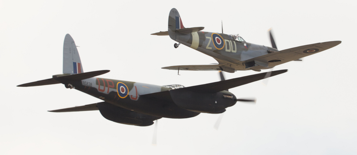 One single-propeller and one dual-propeller plane fly past the camera.