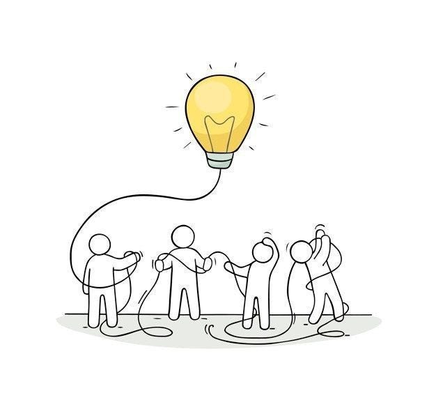 This may contain: a group of people standing around a light bulb