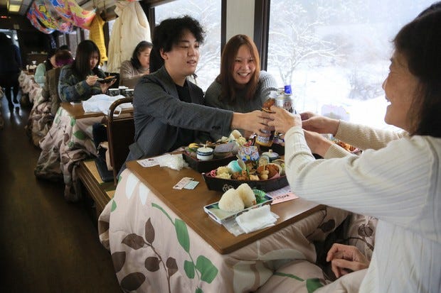 Sightseeing train with 'kotatsu' heated tables delights passengers in  northeastern Japan - The Mainichi
