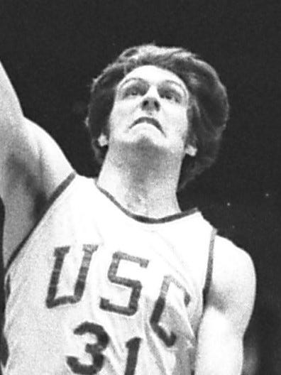Photo: Robert Lachman, Los Angeles Times / Wikimedia Commons (CC BY 4.0) GANGWAY--USC's John Lambert makes Oregon forward Stu Jackson flinch backward as Lambert swoops in to make a layup in Saturday game at the Sports Arena. Trojans held on to win by 92-90 score.