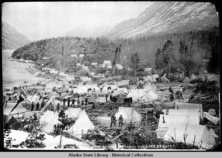 Black-and-white photograph of Boat building, Abbott Cove, Lake Bennett. Black-and-white photograph of Boat building, Abbott Cove, Lake Bennett.