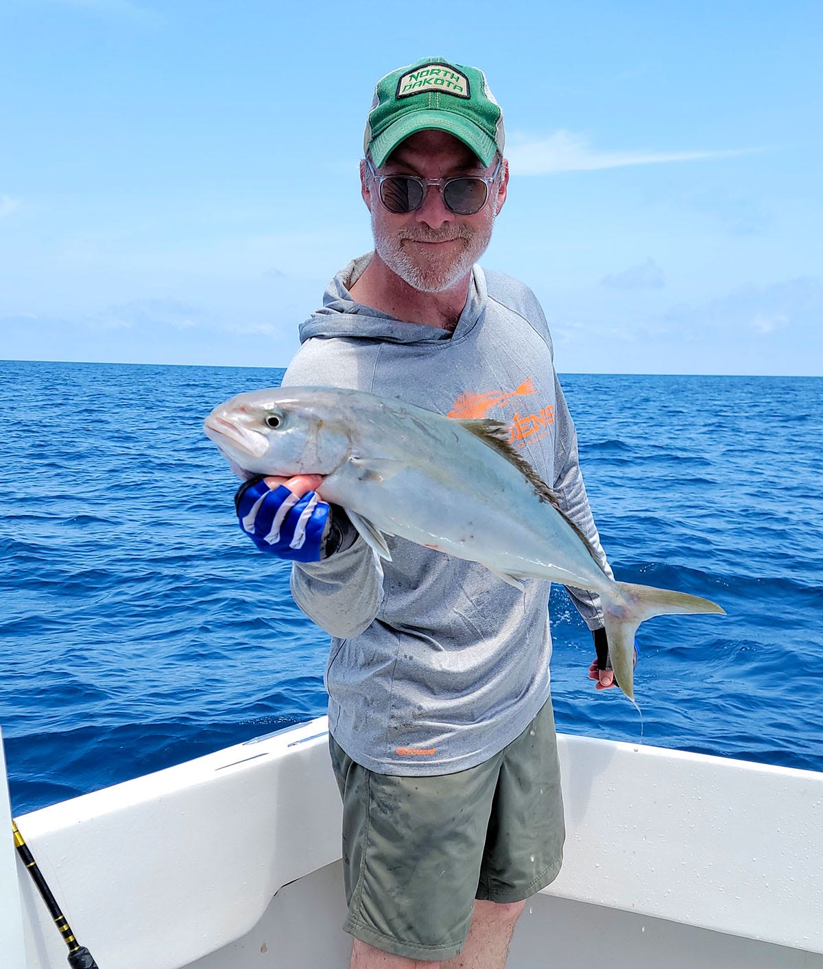 Hank Shaw holding a banded rudderfish.