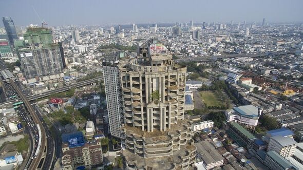 An aerial drone view of the Sathorn Unique Tower or Ghost... An aerial drone view of the Sathorn Unique Tower or Ghost...