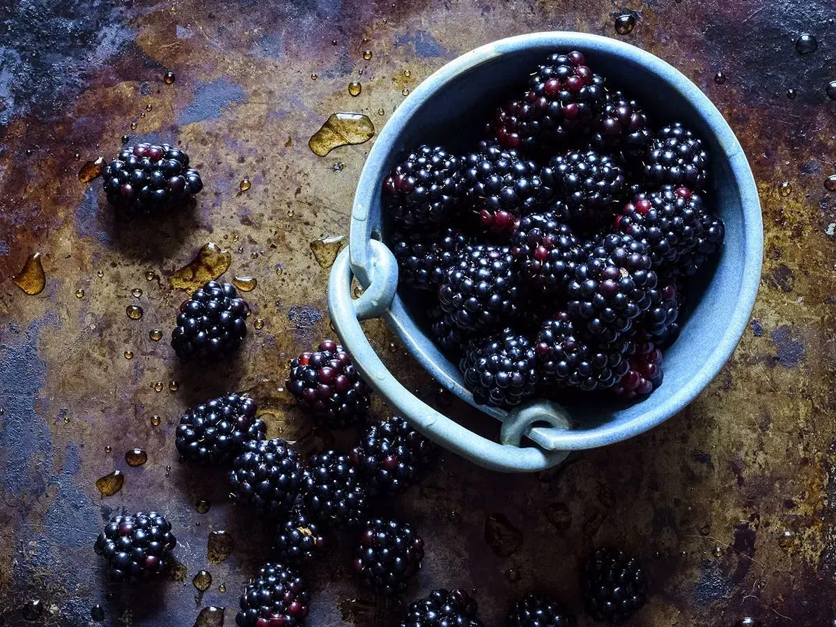 overflowing bowl of blackberries