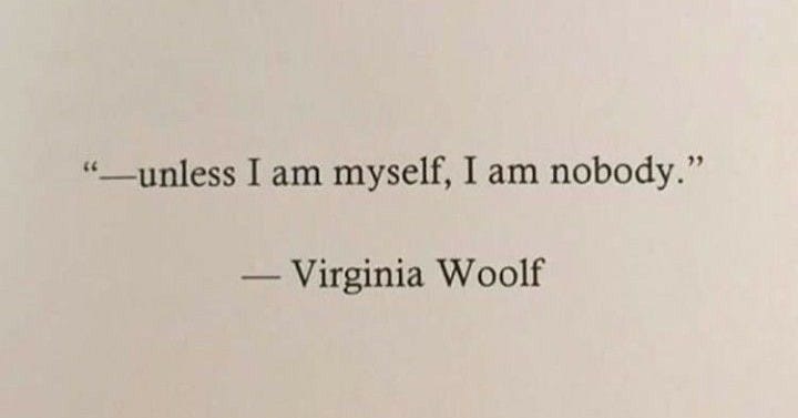 This may contain: an old typewriter with the words unless i am myself, i am nobody virginia woolf