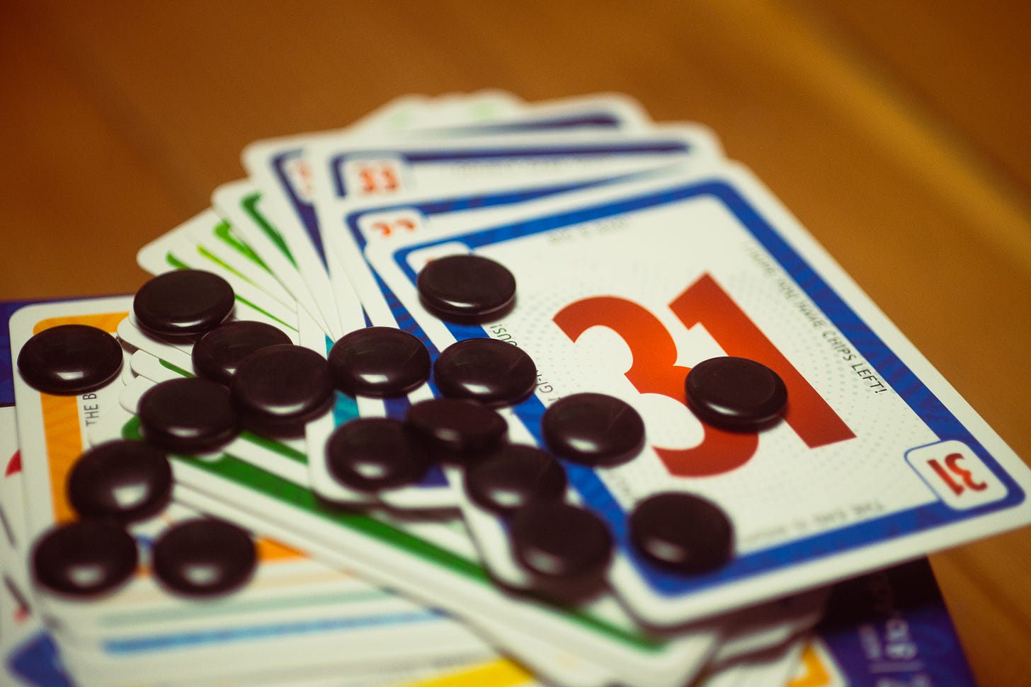 The card game No Thanks! on display with cards and tokens.