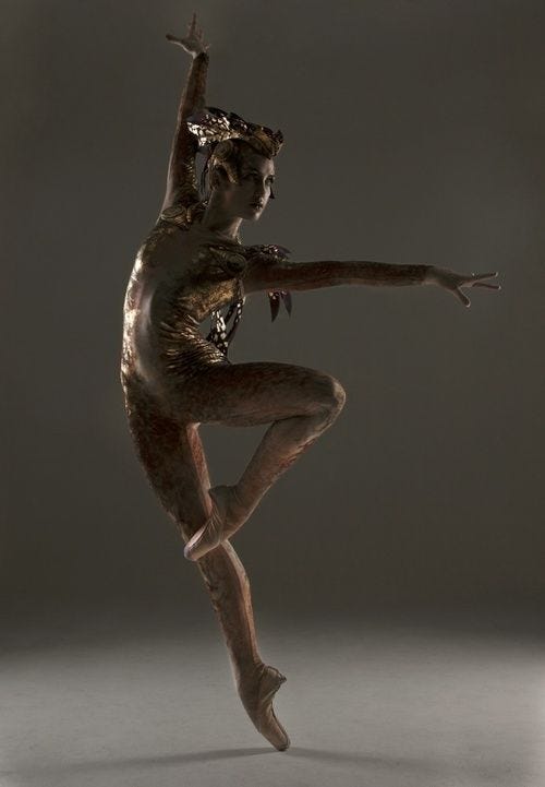 This may contain: a woman is dancing in an artistic pose