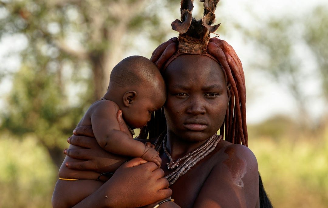 a person carrying a baby