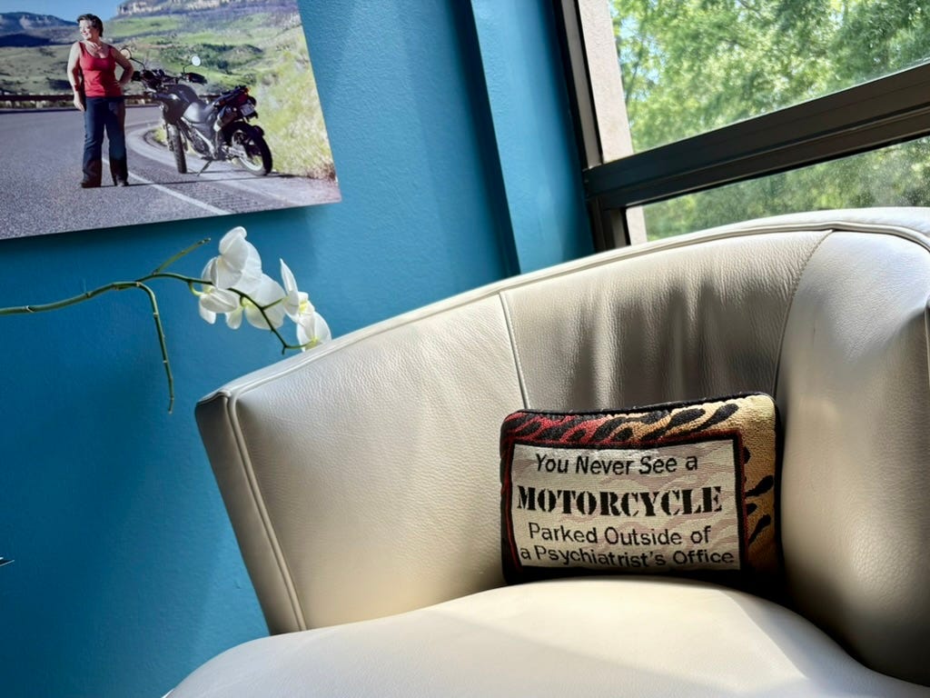white chair with a pillow in an office setting