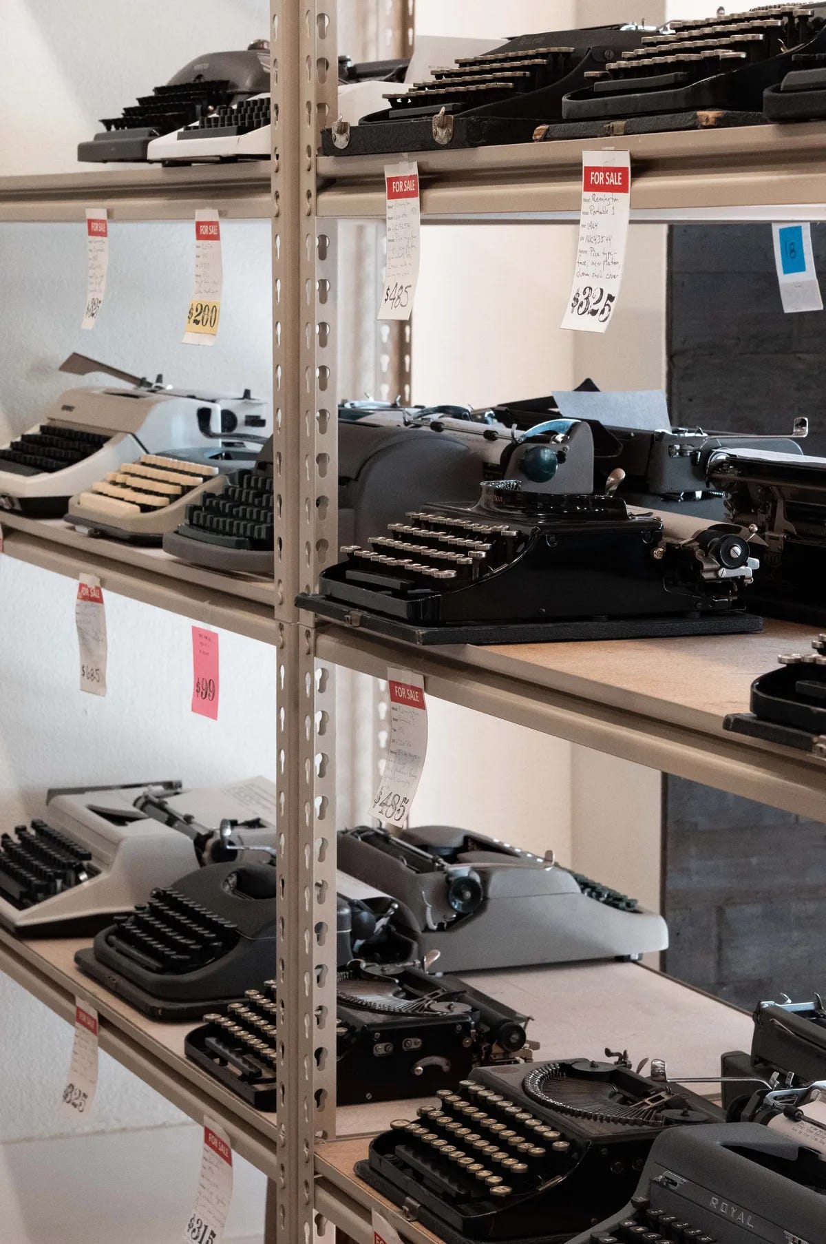 A shelf of typewriters.