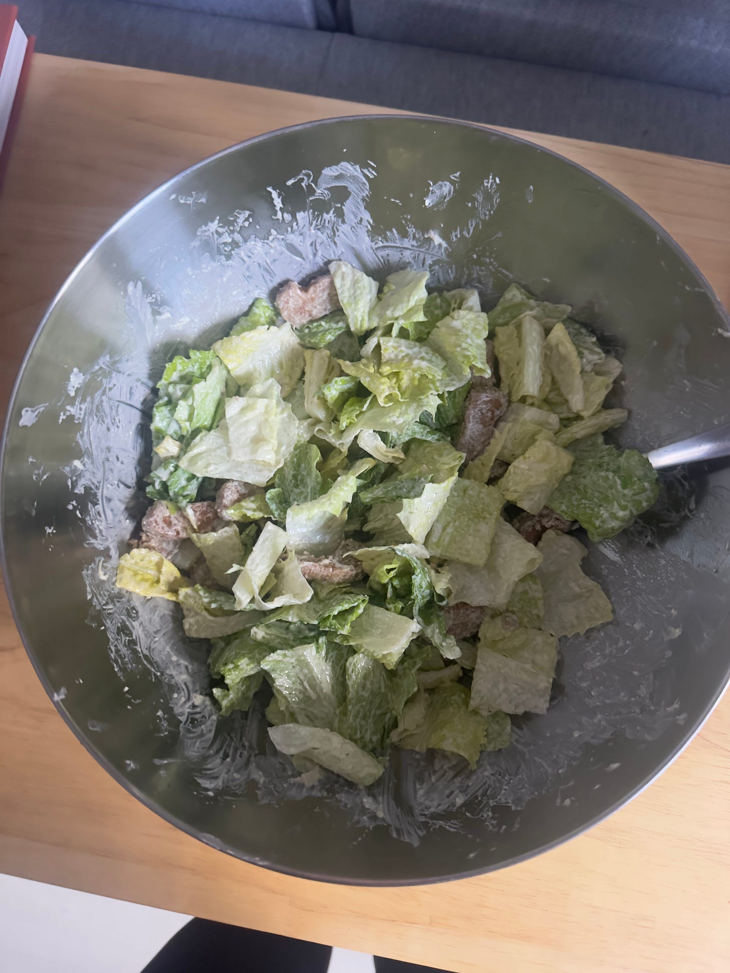 Caesar salad made up in a big metal bowl Caesar salad made up in a big metal bowl