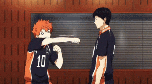 a boy with the number 10 on his shirt is standing next to another boy a boy with the number 10 on his shirt is standing next to another boy