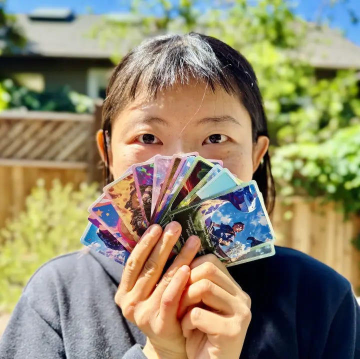 Nico holding Alpha Cards