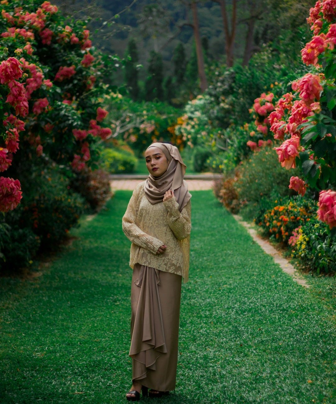 woman standing on green grass
