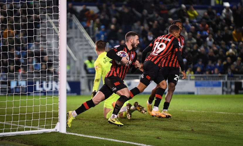 Conor Chaplin retrieves the ball after scoring the equaliser at Fratton park, December 2022