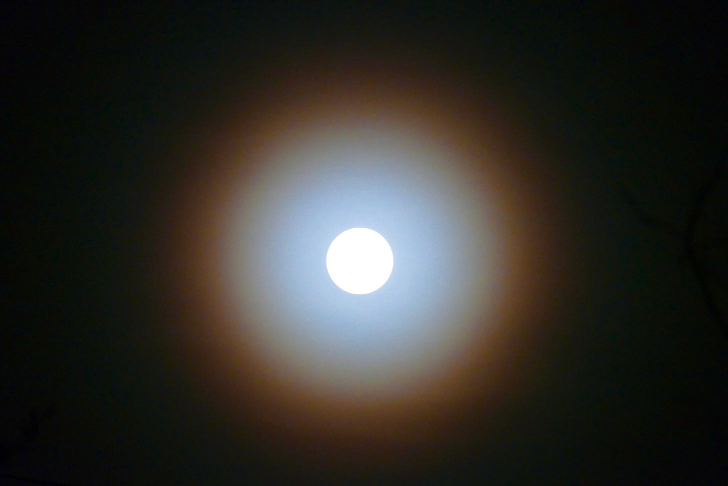 Pink full moon with intense corona Pink full moon with intense corona