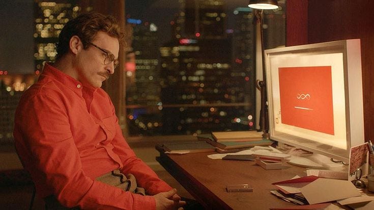 This may contain: a man sitting at a desk in front of a computer monitor