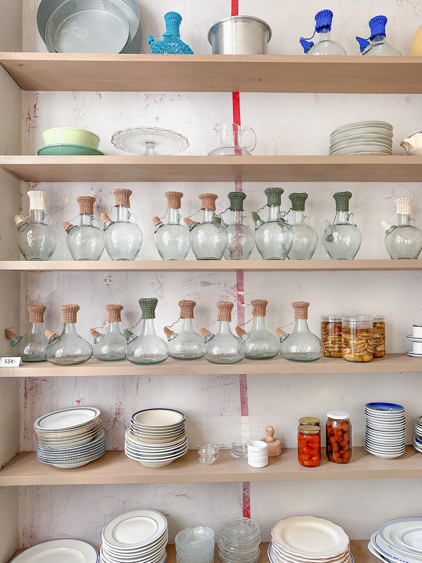 Close-up of decorative glass bottles with crochet covers, highlighting the Lebanese and Scandinavian fusion at BeitSalma. Unique decor elements that stand out.
