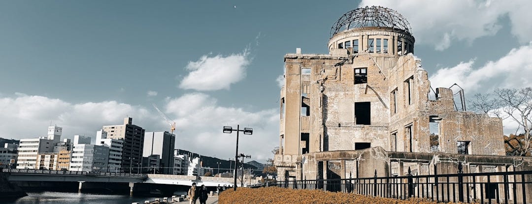 a building with a dome on top of it next to a body of water a building with a dome on top of it next to a body of water