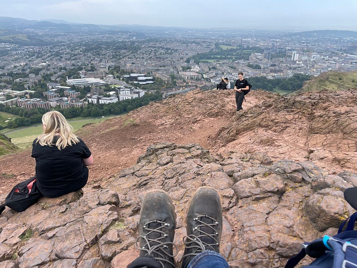 One picture is of a Lothian Bus. Another is of a tram. Another is a picture of my feet sat atop Arthur's Seat. And the final one is some blackberries.
