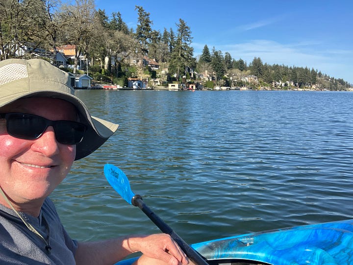 Images of Lake Oswego, Oregon and people paddling in kayaks
