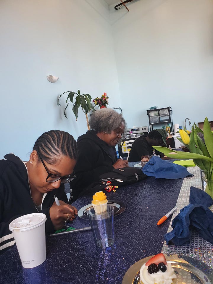 Images from DSM.215's celebration circle, photos of community members sharing food, laughing, and engaging in a gratitude exercise