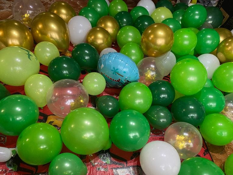 Balloons for dinosaur-themed kiddie birthday party at home Balloons for dinosaur-themed kiddie birthday party at home