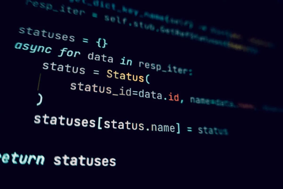 Dark code editor with async Python on screen