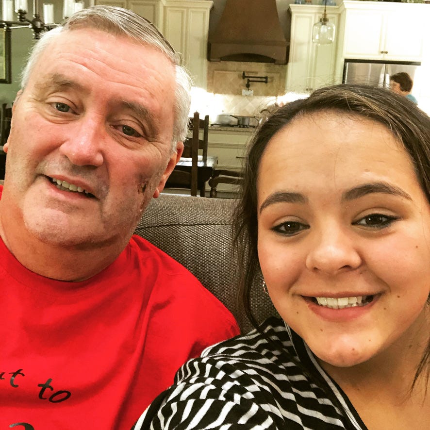 Austin Gardner and granddaughter after returning home from Covid sit together
