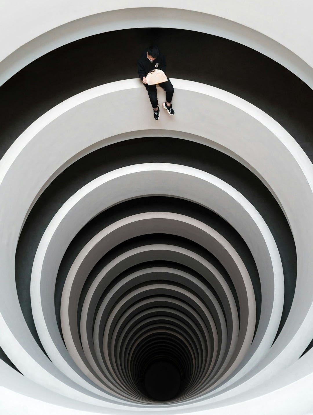 man sitting on deep pit design