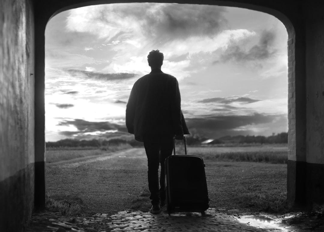 man holding luggage photo man holding luggage photo