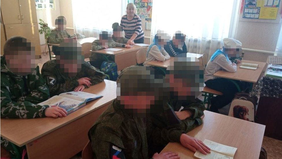 Ukrainian children wearing Russia military uniforms Ukrainian children wearing Russia military uniforms