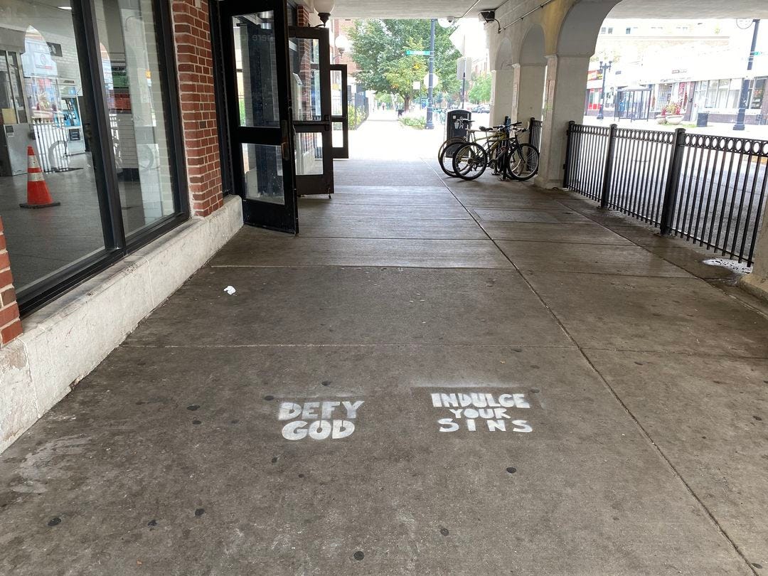 May be an image of cash machine, garbage, curb and text
