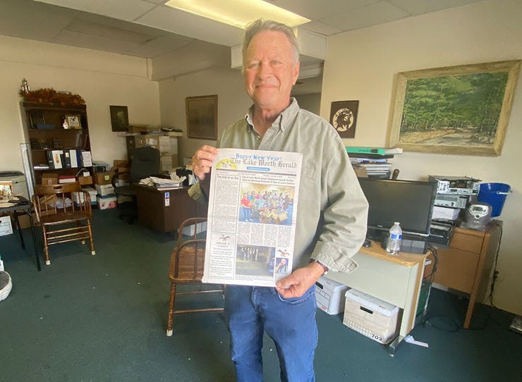 Mark Easton holds final issue of Lake Worth Herald, a weekly launched in 1912. (JOE CAPOZZI) Mark Easton holds final issue of Lake Worth Herald, a weekly launched in 1912. (JOE CAPOZZI)