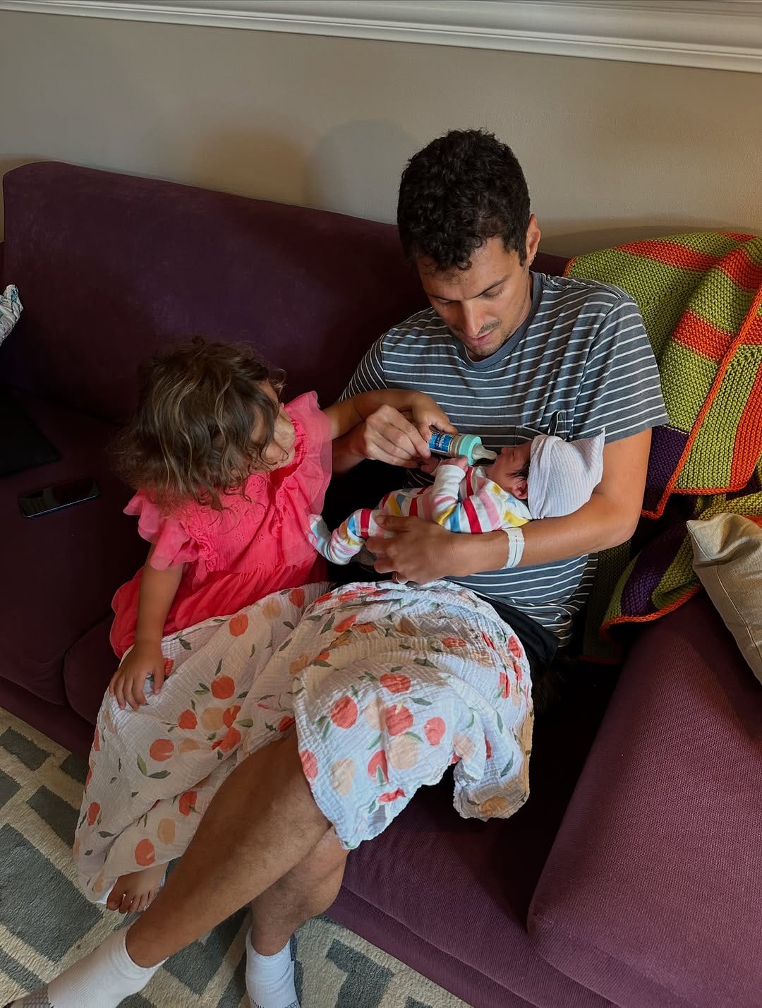 Danny’s husband Steve and their two daughters on the couch Danny’s husband Steve and their two daughters on the couch