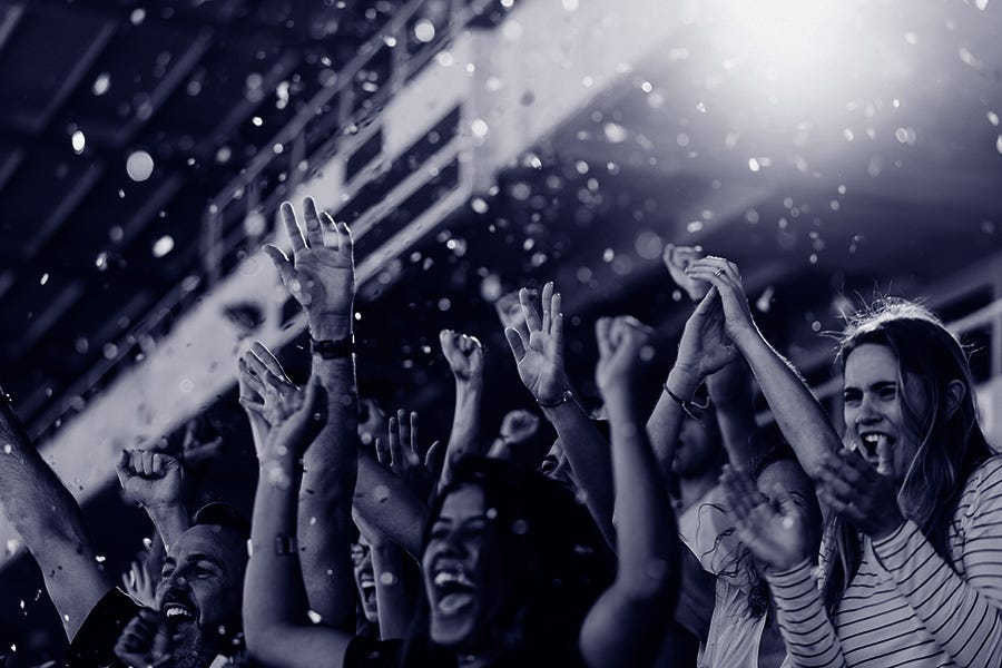 Pic of people cheering Pic of people cheering